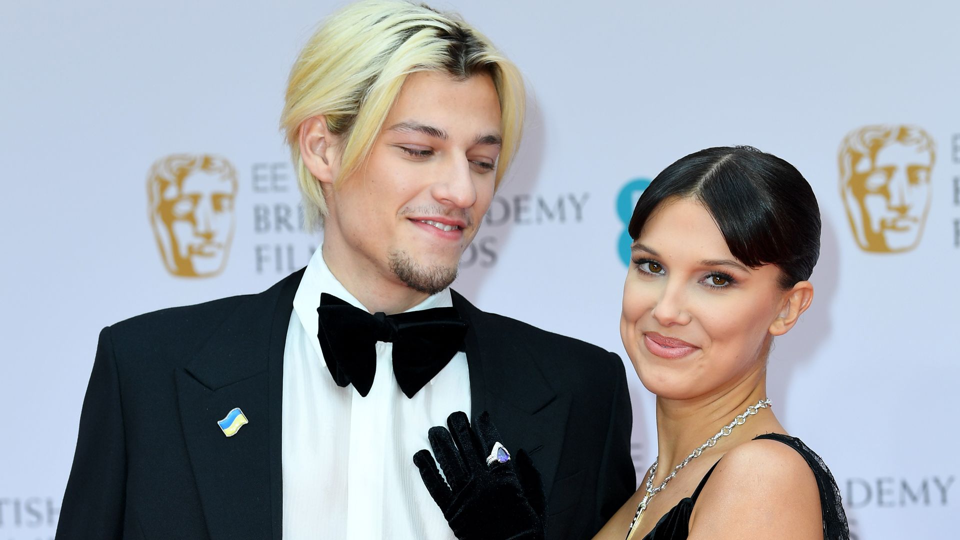 Jake Bongiovi and Millie Bobby Brown attend the EE British Academy Film Awards 2022 at Royal Albert Hall on March 13, 2022 in London, England