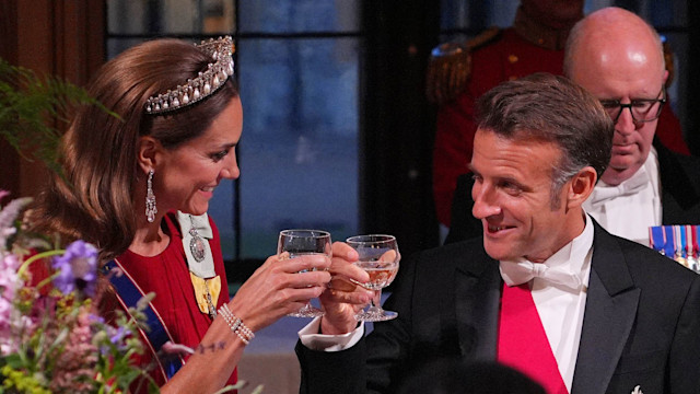  France's President Emmanuel Macron clinks glasses with Catherine, Princess of Wales