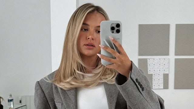 Molly-Mae Hauge poses in a grey blazer on her Instagram