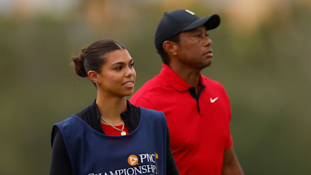 Tiger Woods of the United States and daughter, Sam Woods, look on from the 18th green during the final round of the PNC Championship at The Ritz-Carlton Golf Club on December 17, 2023 in Orlando, Florida