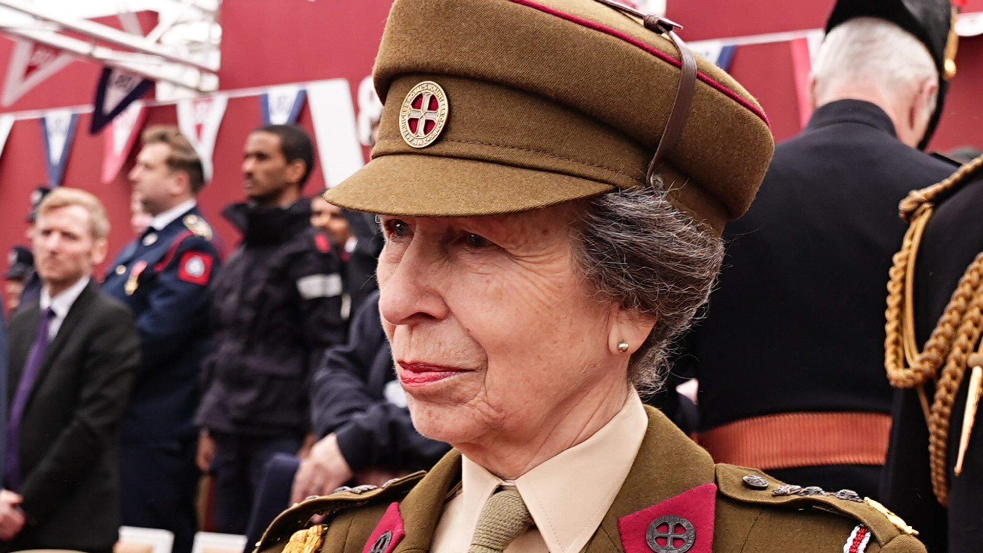Princess Anne in a miliaty uniform in front of Sit Tim Laurence
