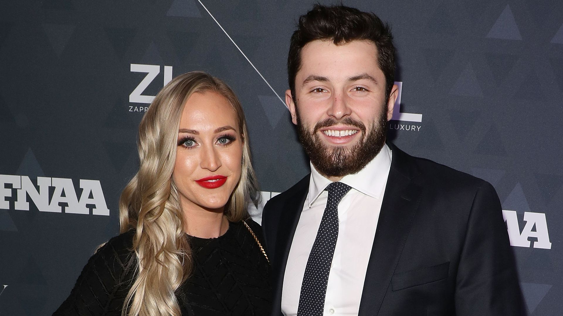 Baker Mayfield and Emily Wilkinson attend the 2018 Footwear News Achievement Awards