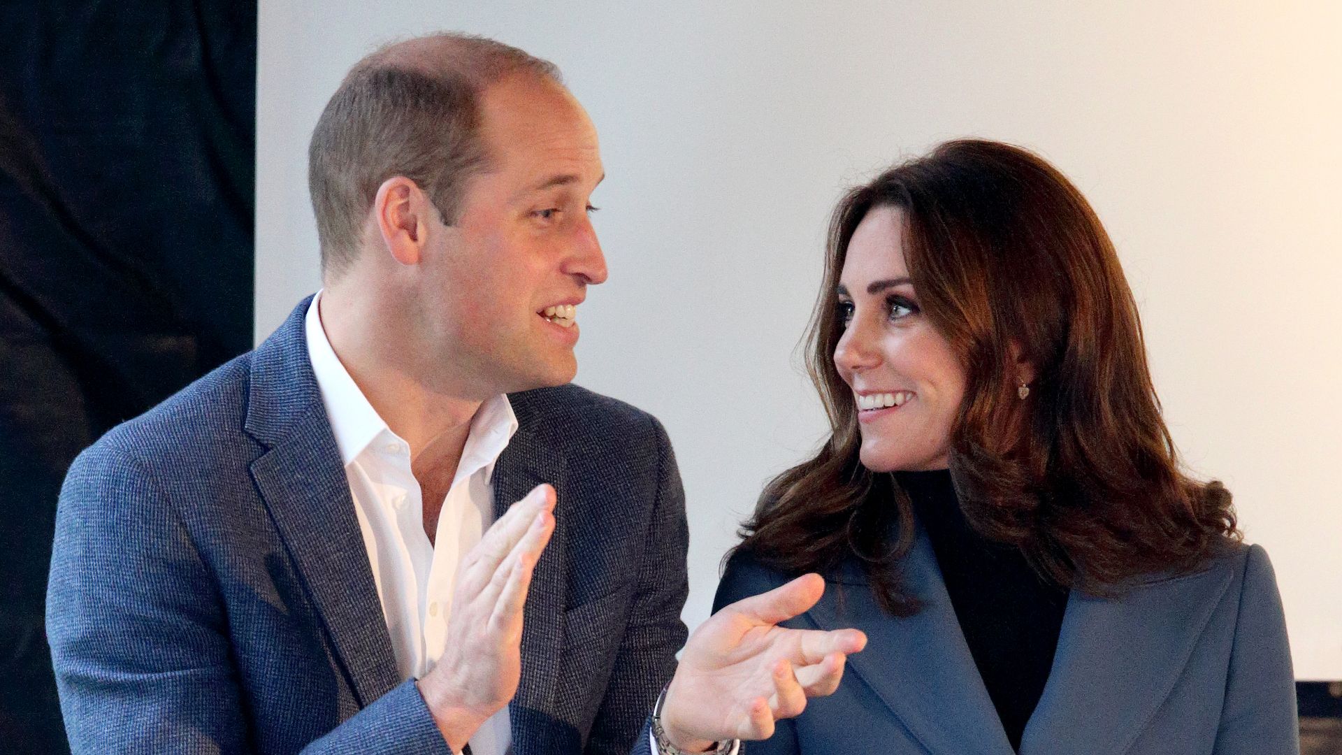 prince william in blue jacket looking at kate middleton