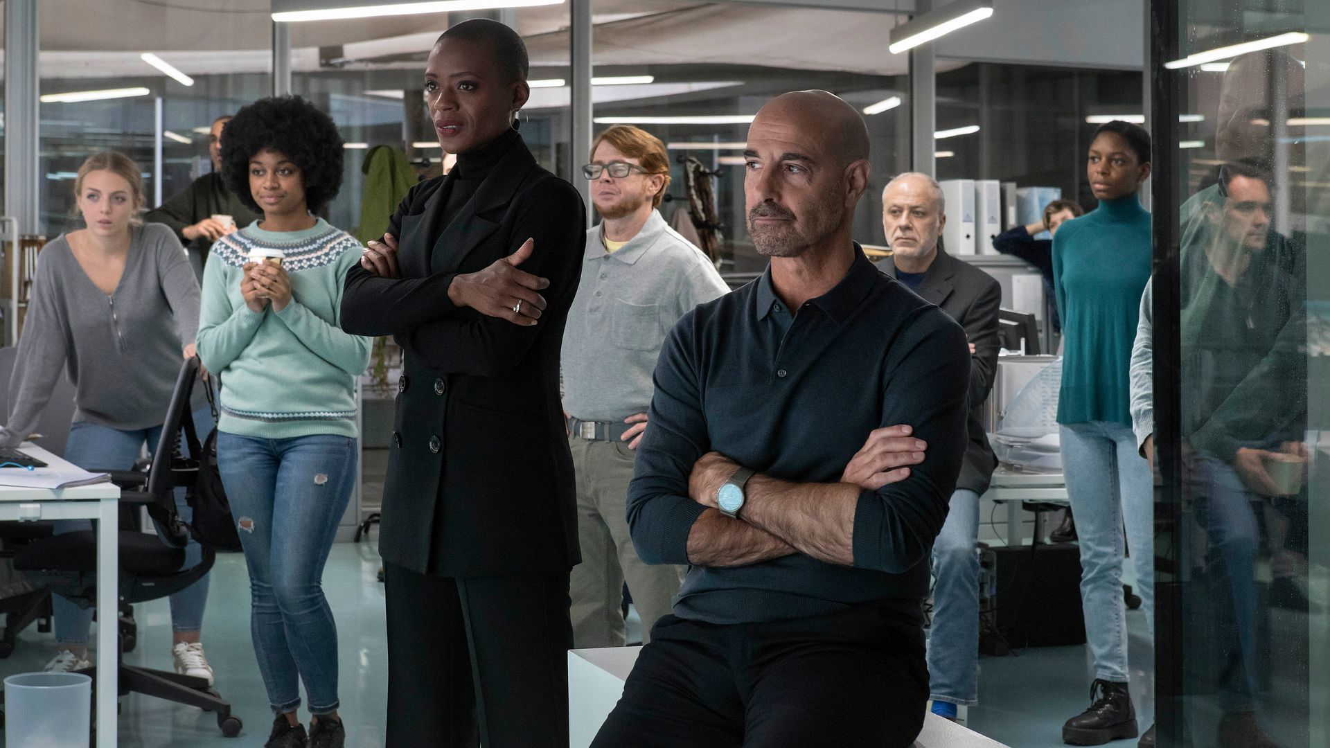 group of people gathered around in office