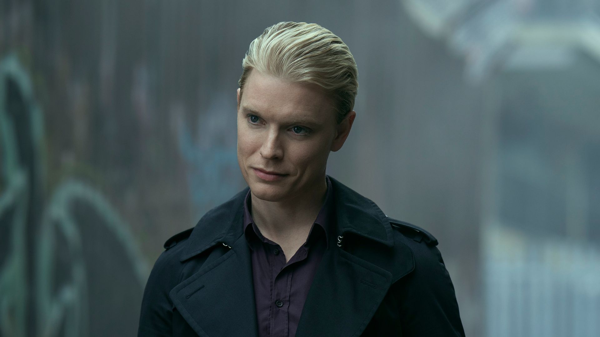 blonde man wearing dark jacket 