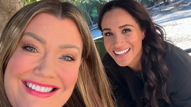 Meghan Markle smiling with her friend Jamie Kern Lima in a selfie taken outside