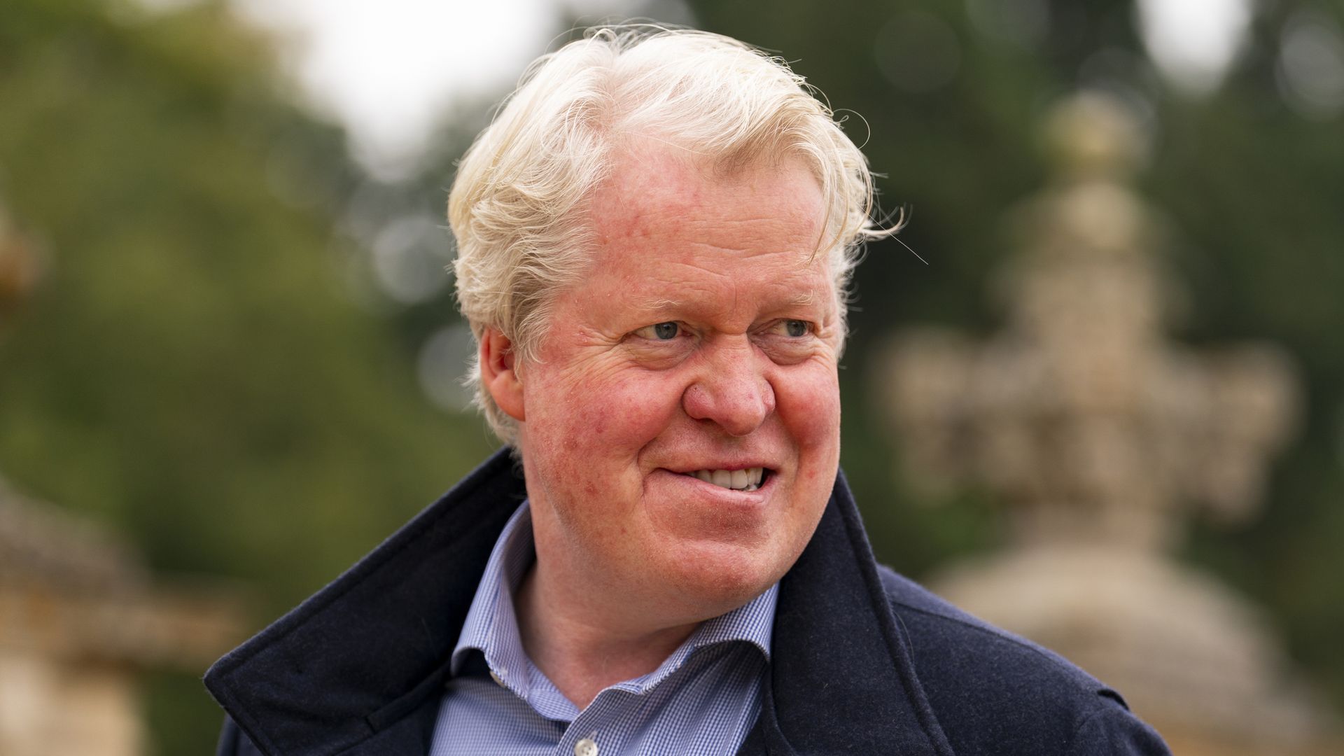 earl spencer smiling in shirt and casual jacket