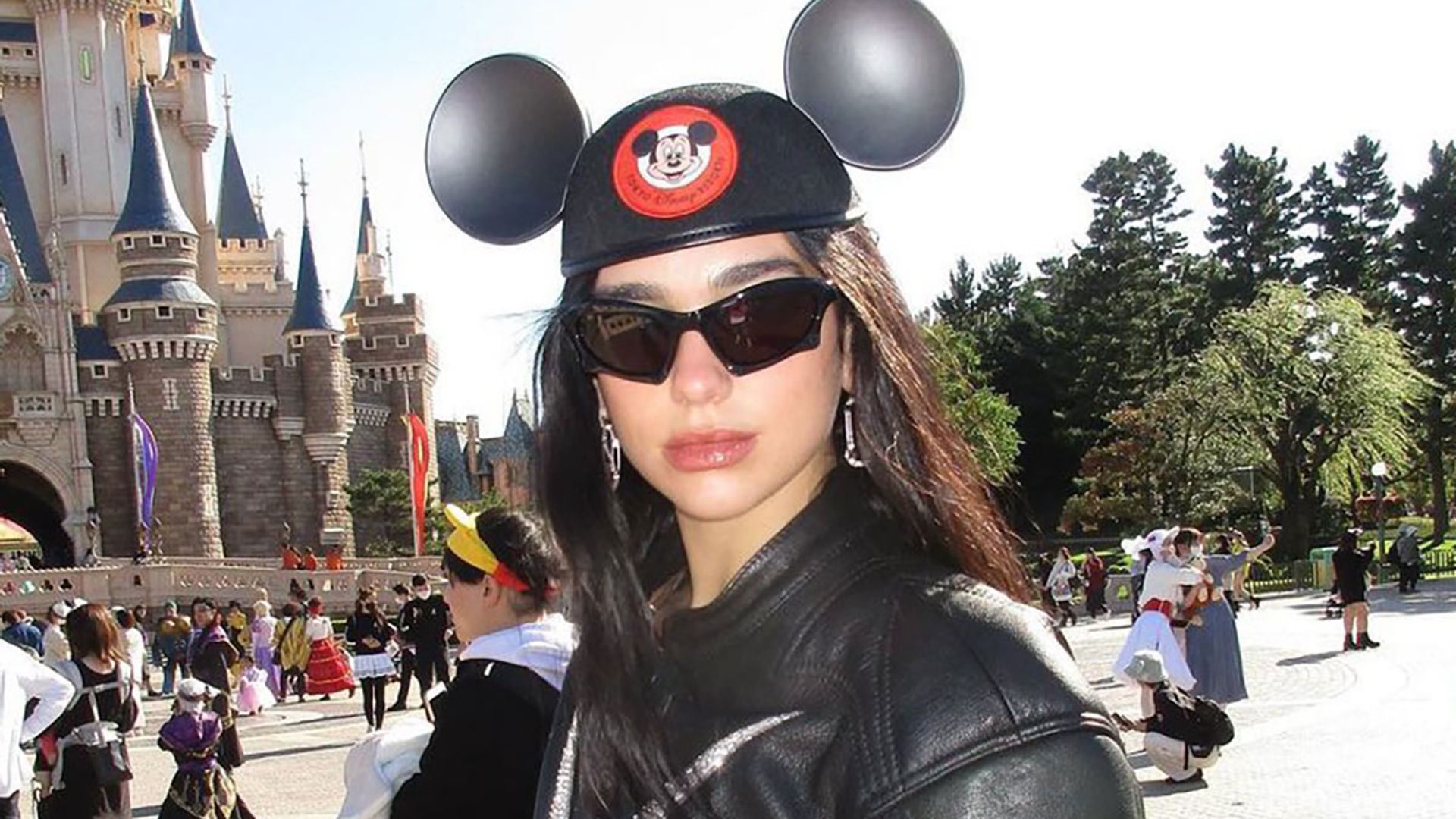 Dua Lipa's rhinestone Disneyland outfit is next level extra – see photos
