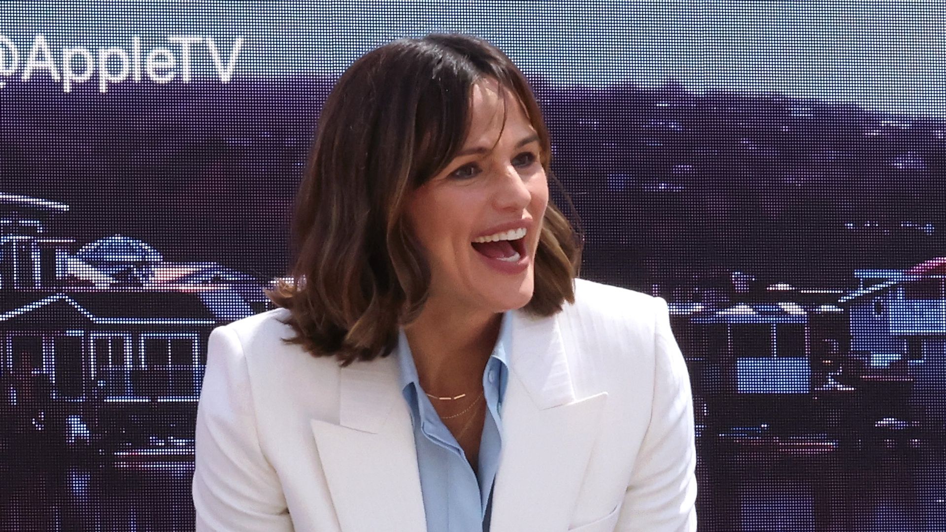 Jennifer Garner laughing in a white suit