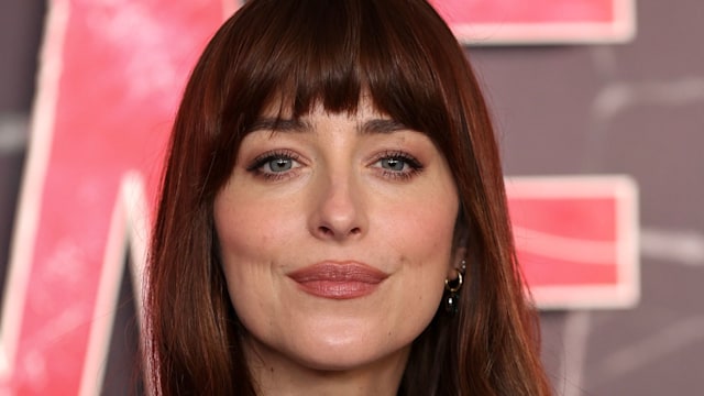 Dakota Johnson in black blazer close up