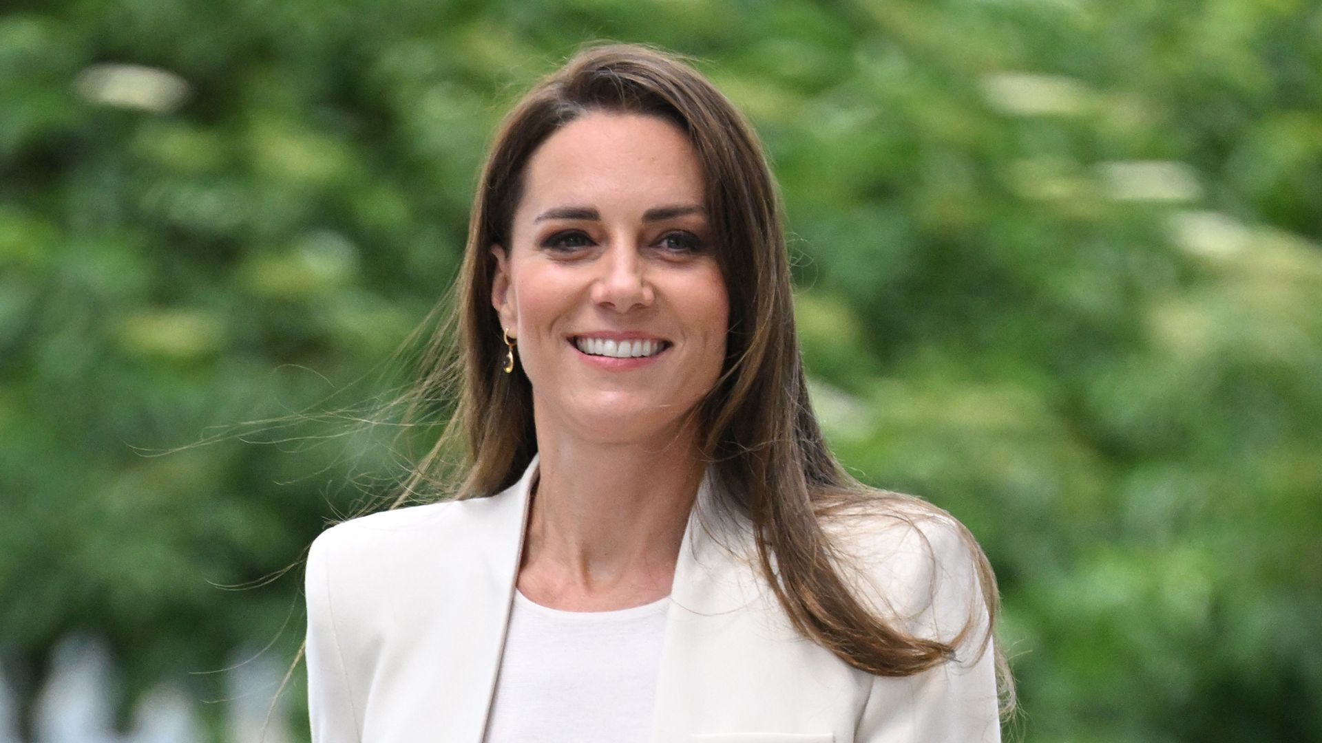 Kate Middleton wearing a white blazer 