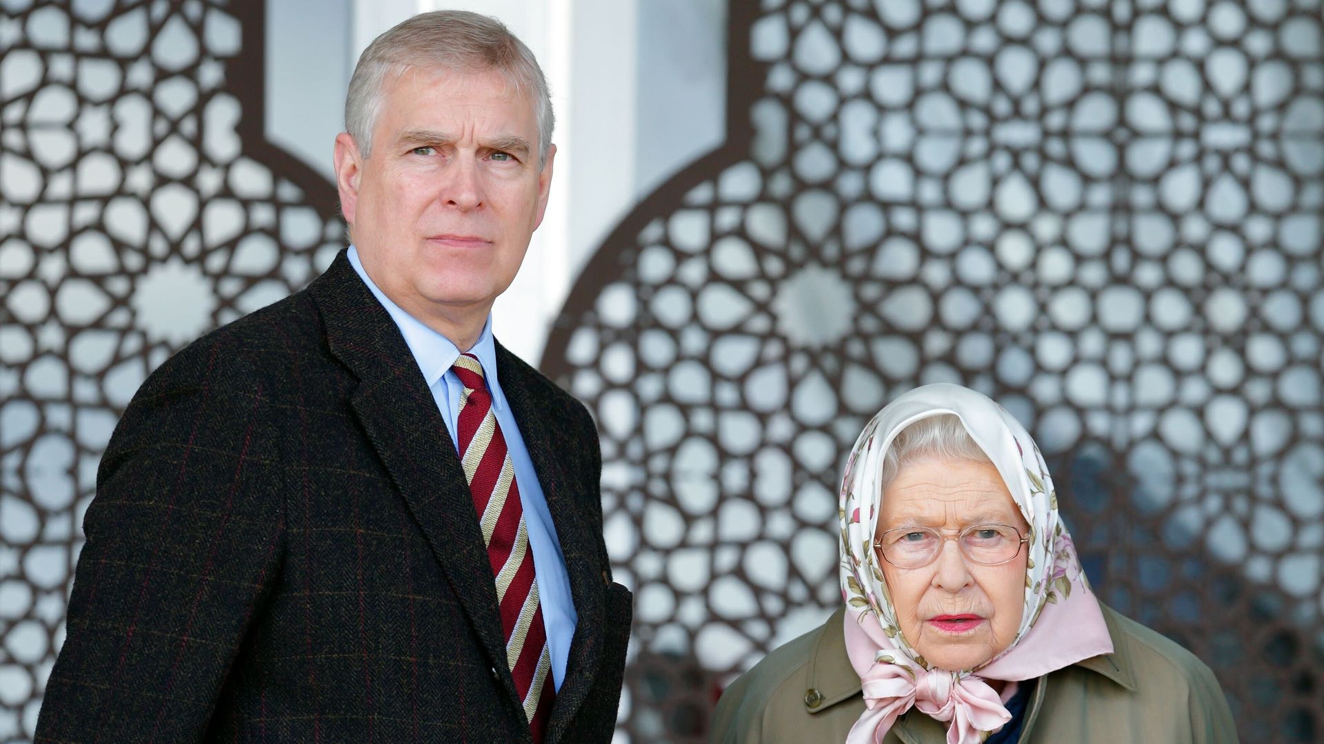 Prince Andrew standing with the late Queen
