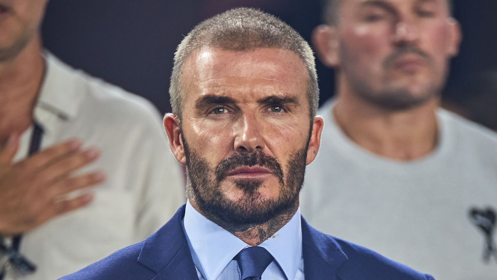 David Beckham looking stern at a football match