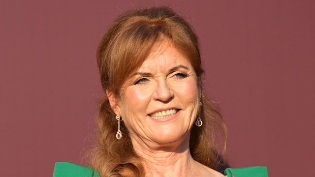 Sarah Ferguson, Duchess of York  attends the 3rd "Knights Of Charity" Gala at Chateau de la Croix des Gardes on July 17, 2025 in Cannes, France. She is wearing a green Safiyaa cape dress.
