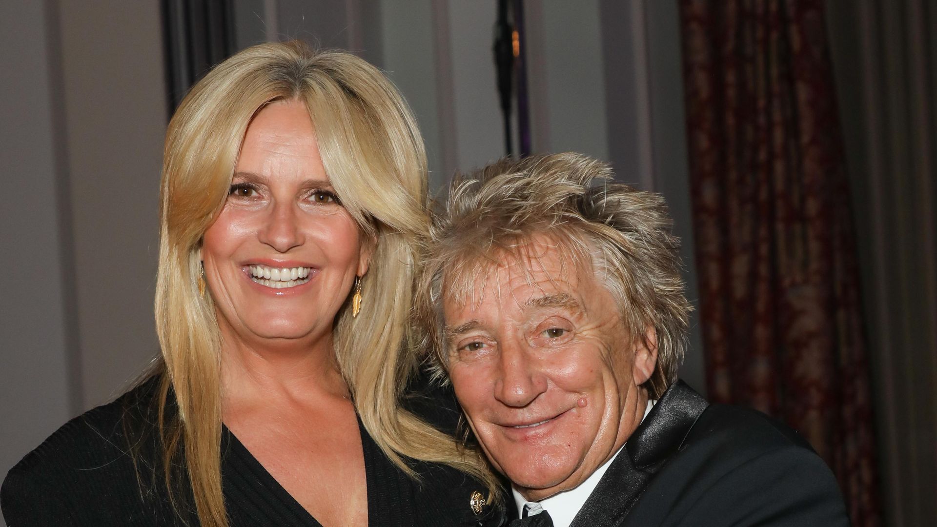 Penny Lancaster and Rod Stewart in black