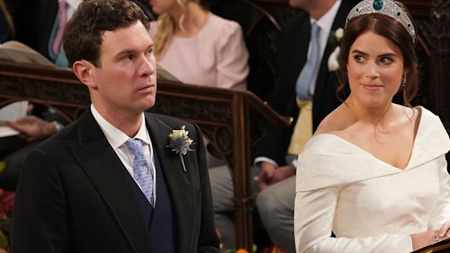 Jack Brooksbank and Princess Eugenie of York kneel during their wedding ceremony