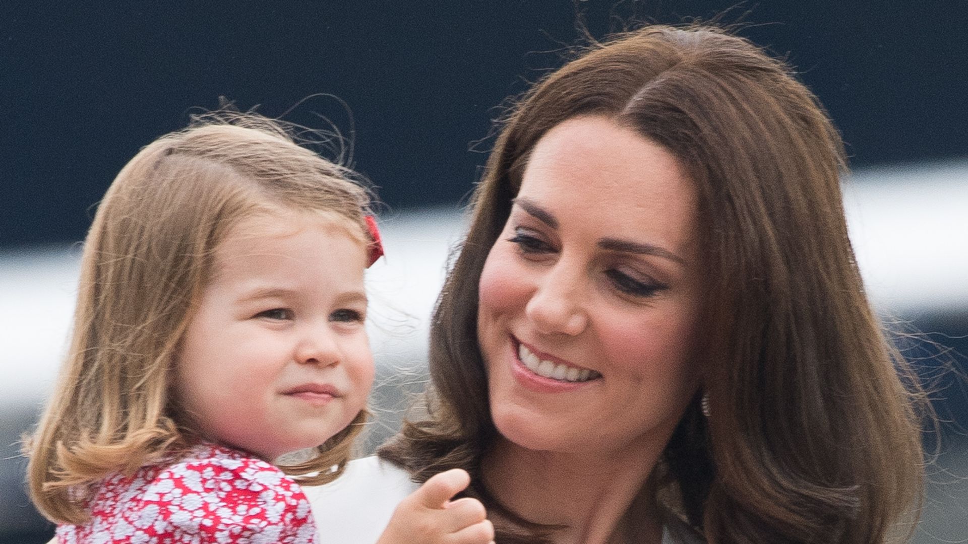 Princess Kate holding Princess Charlotte 