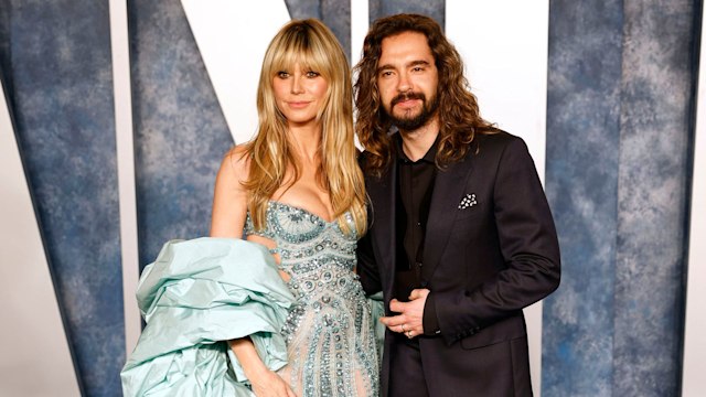 Heidi and Tom Kaulitz smiling at the Oscars 2023