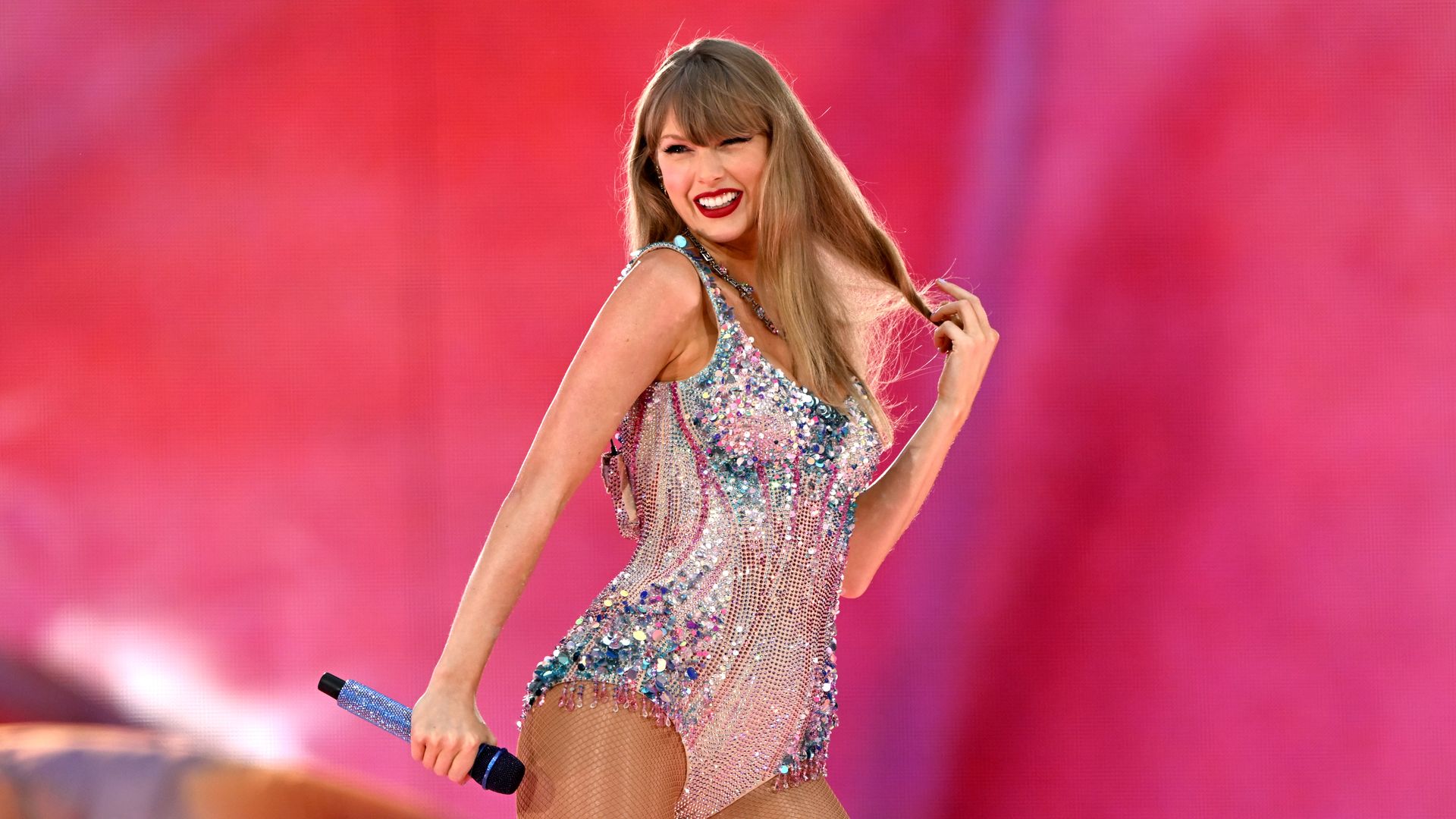 Taylor Swift in glitzy bodysuit on stage