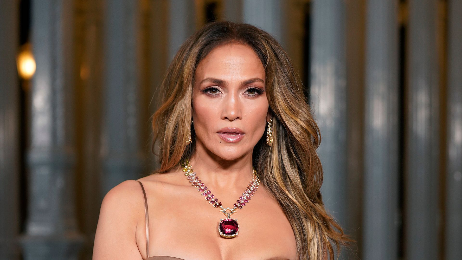 Jennifer Lopez wears a beige Gucci gown to attend the 2023 LACMA Art+Film Gala