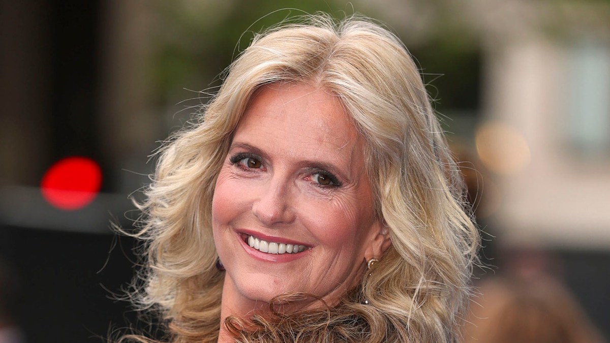 Penny Lancaster shimmers in body-gliding dress alongside towering model son Alastair
