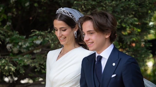 Rajwa Al-Saif walking to the altar with her groom's younger brother, Prince Hashem