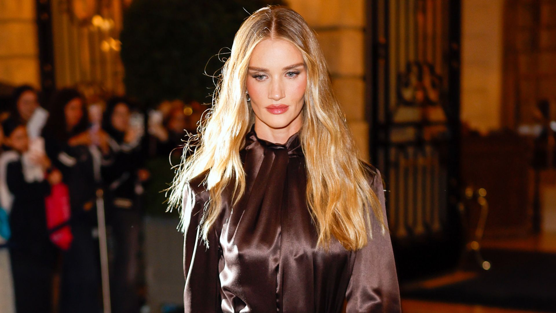 Rosie Huntington-Whiteley surprises in glittery suspenders at Saint Laurent show