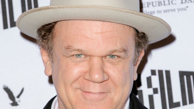 John Reilly wearing a hat