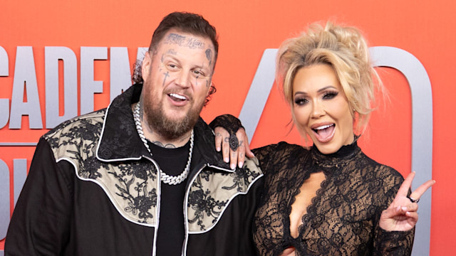 jelly roll and bunnie xo on red carpet smiling