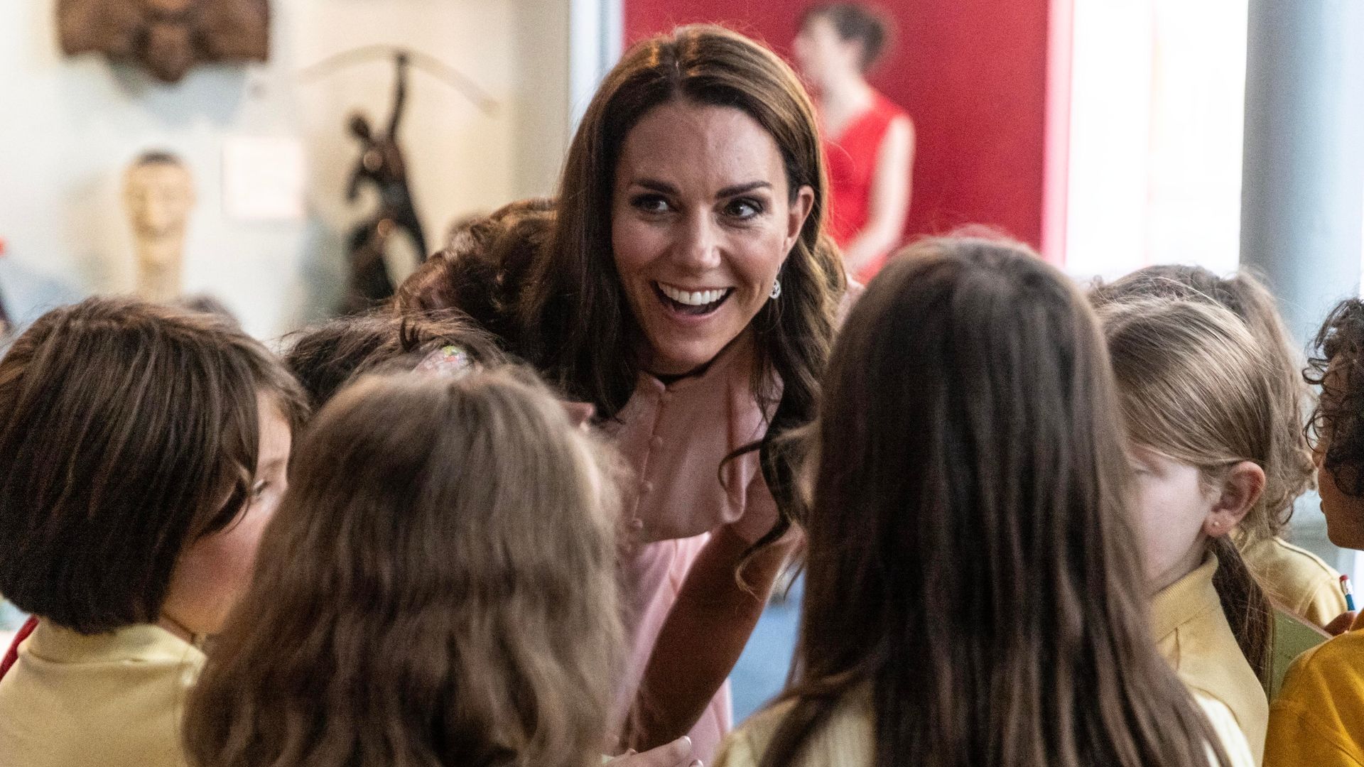 Kate Middleton speaks with children