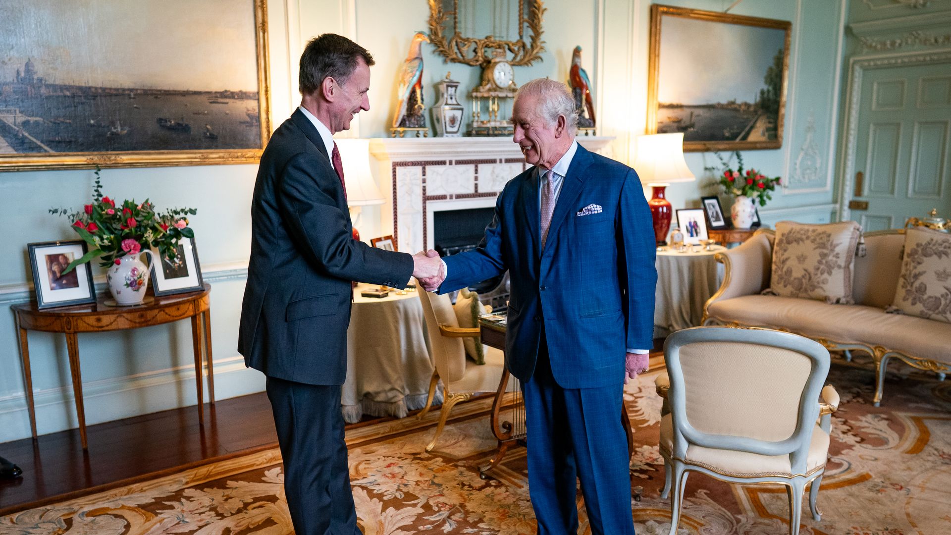 King Charles shakes Jeremy Hunt's hand