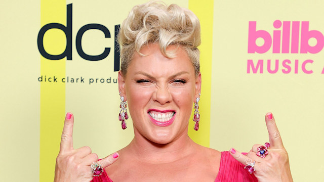 pink throwing up rock signs