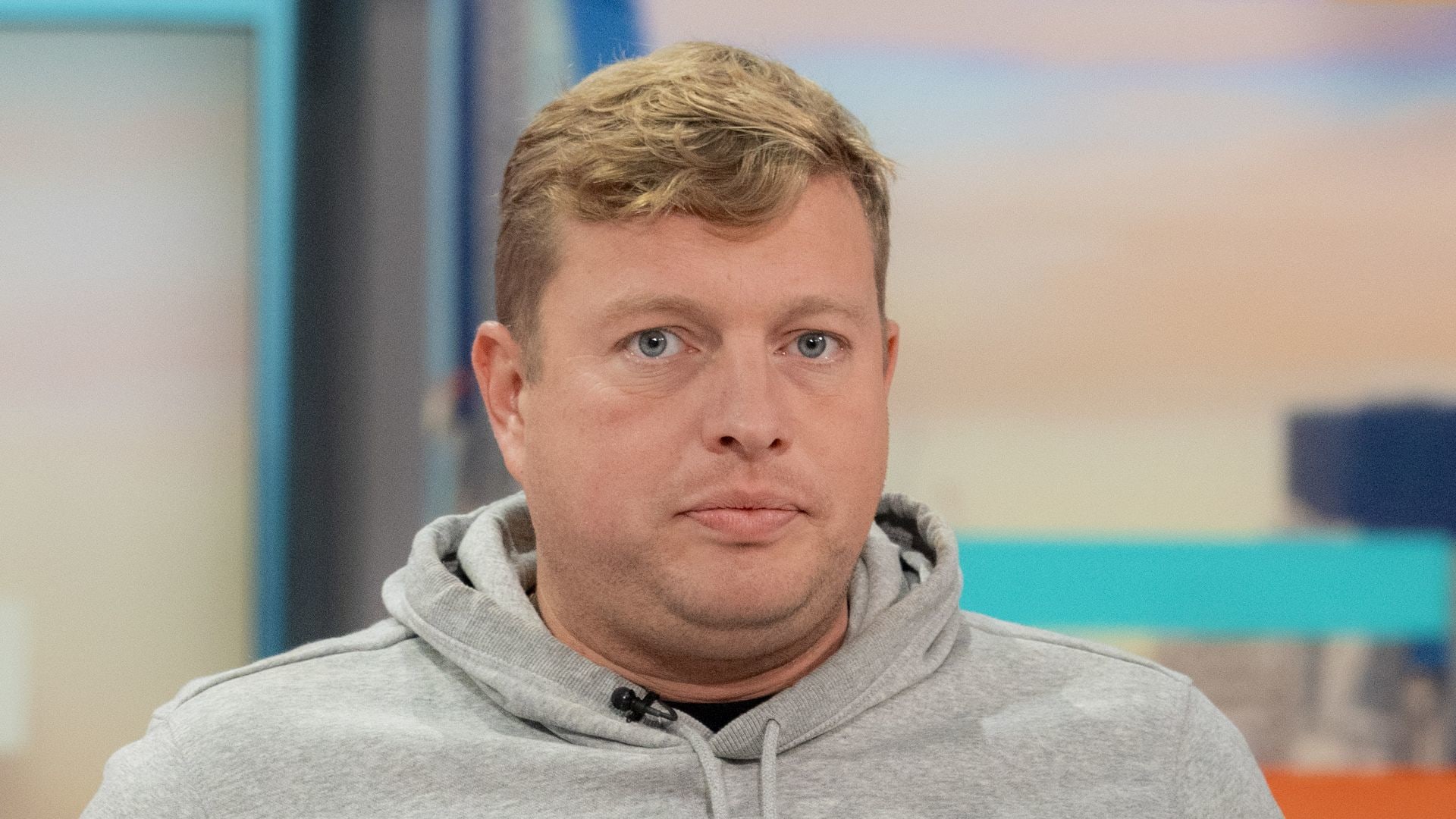 Thomas Skinner looking downbeat in a grey hoodie