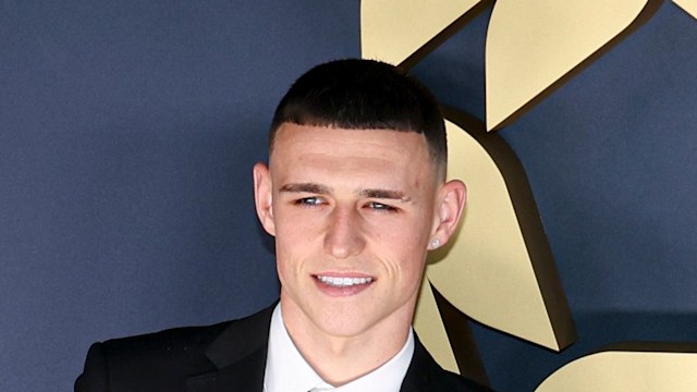 phil foden in suit on red carpet