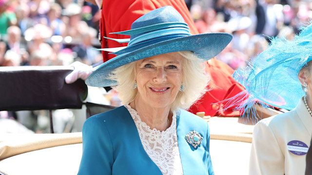 Queen Camilla in aqua coat