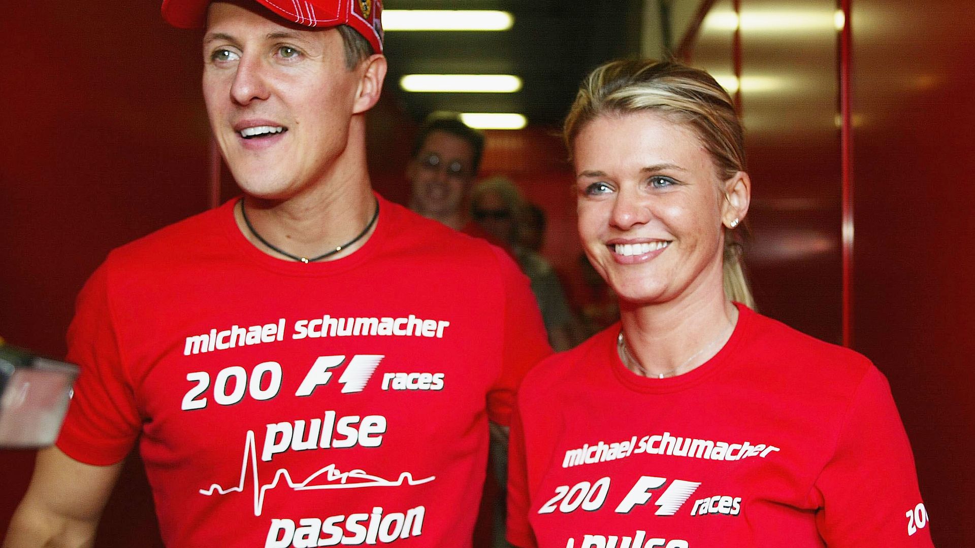 Michael Schumacher of Germany and Ferrari celebrates with his wife Corrina after competing in his 200th Grand Prix during the Spanish F1 Grand Prix on May 9, 2004, 