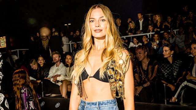 Margot Robbie surprises in swimwear and dramatic flares at Chanel show