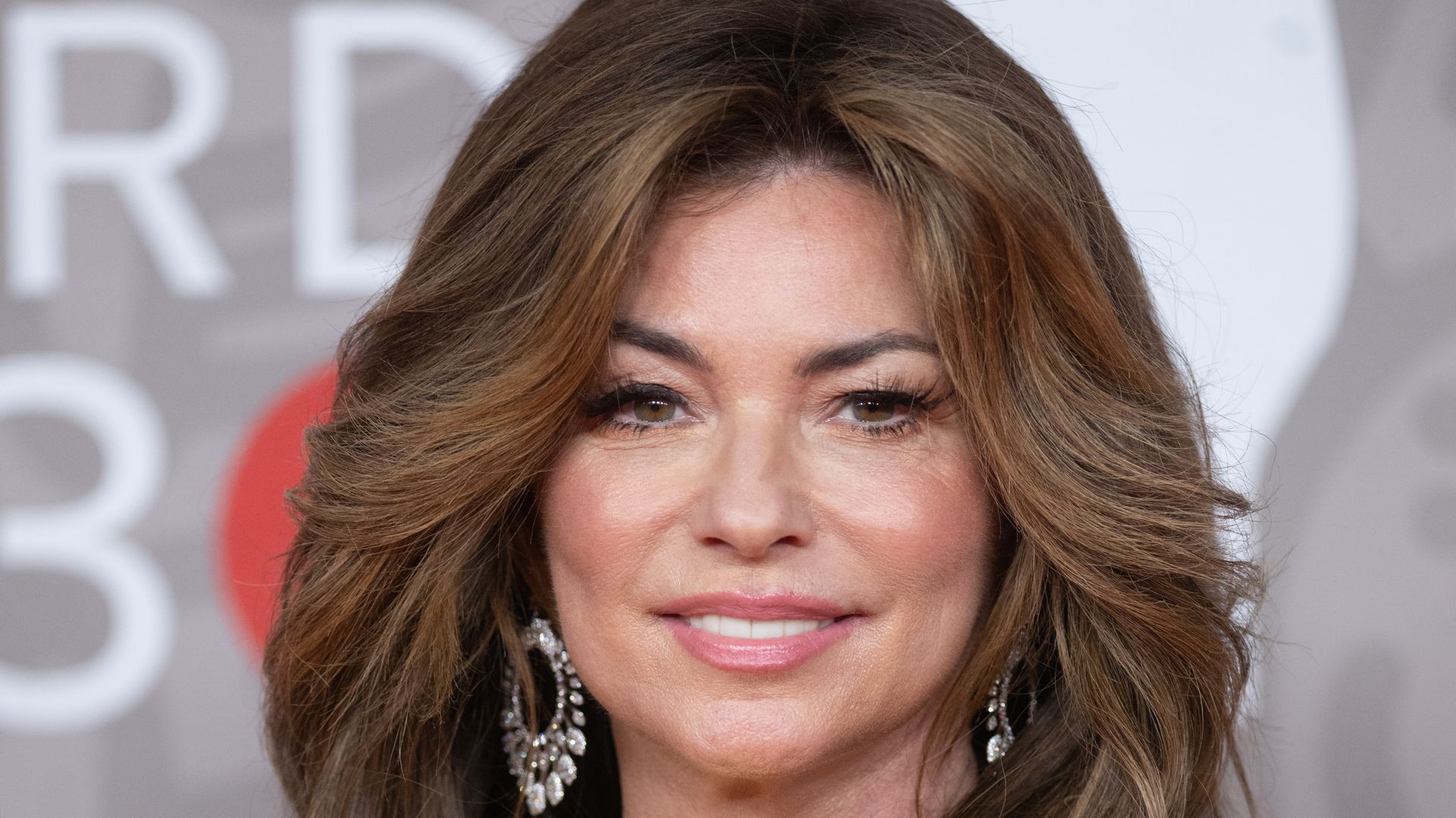 Shania Twain, 58, looks 'younger than ever' in daring strapless mini-dress