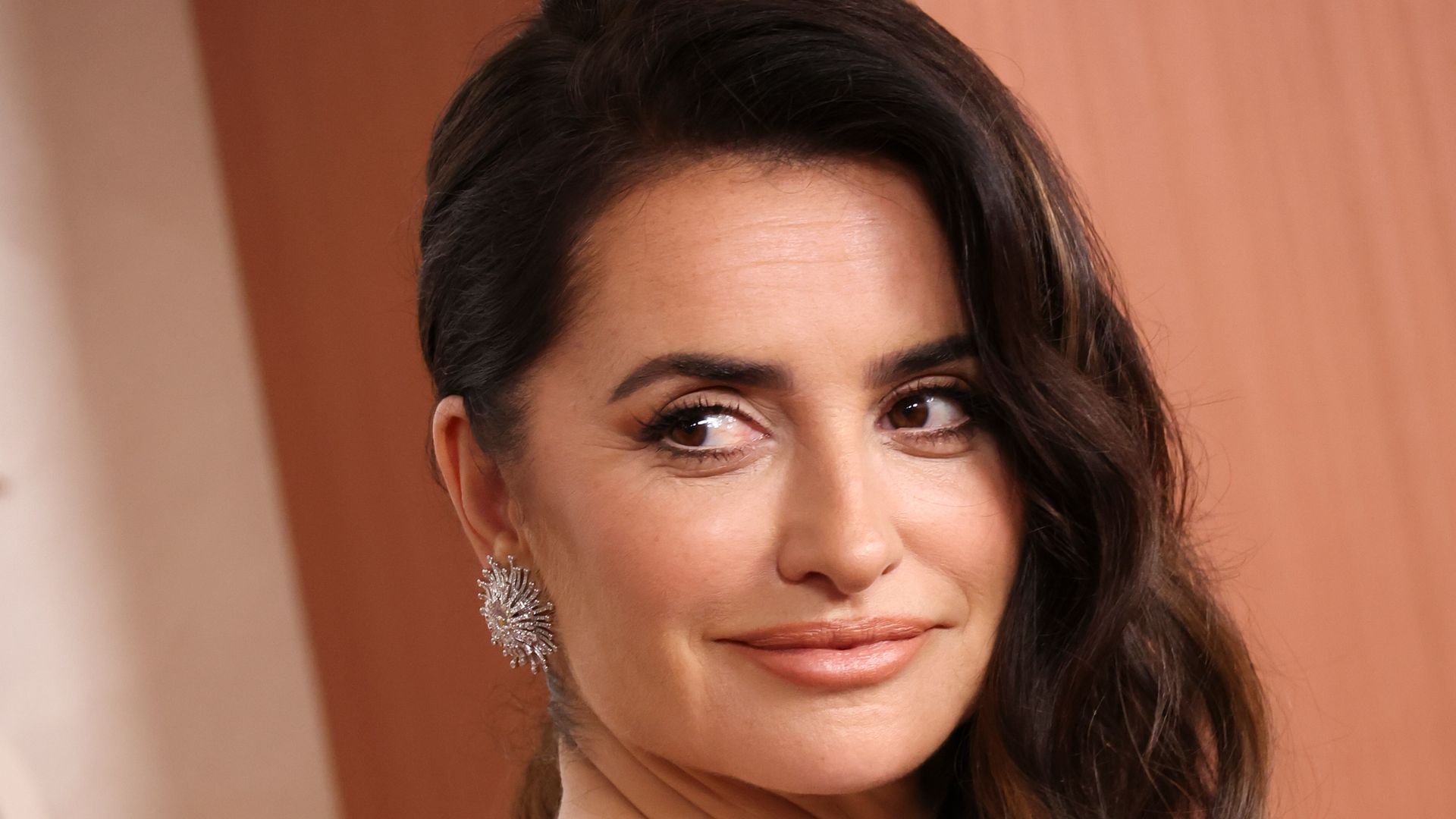 Penelope Cruz wows in bridal white gown complete with statement train