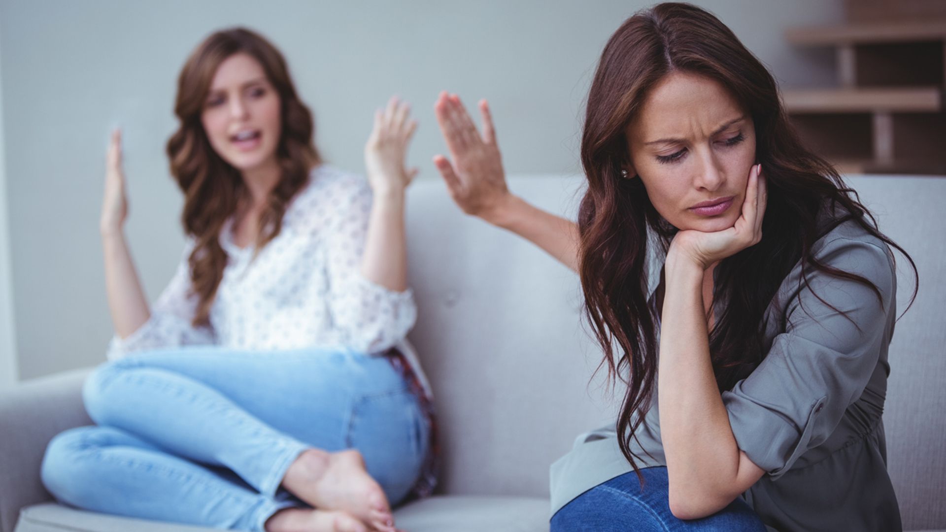two woman arguing while seated on a sofa toxic 