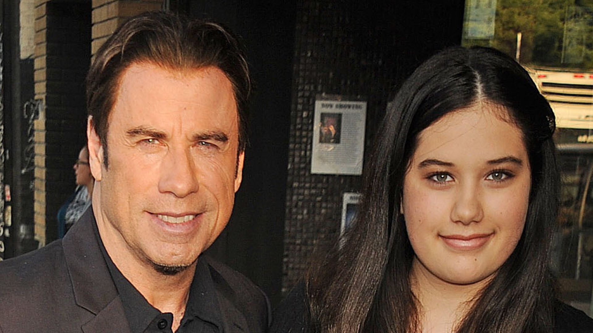 John Travolta and Ella Travolta stood next to each other