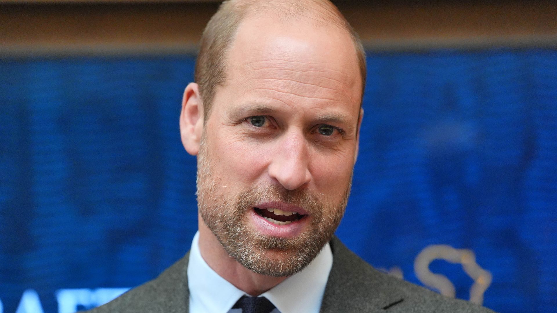 close-up of bearded man in suit