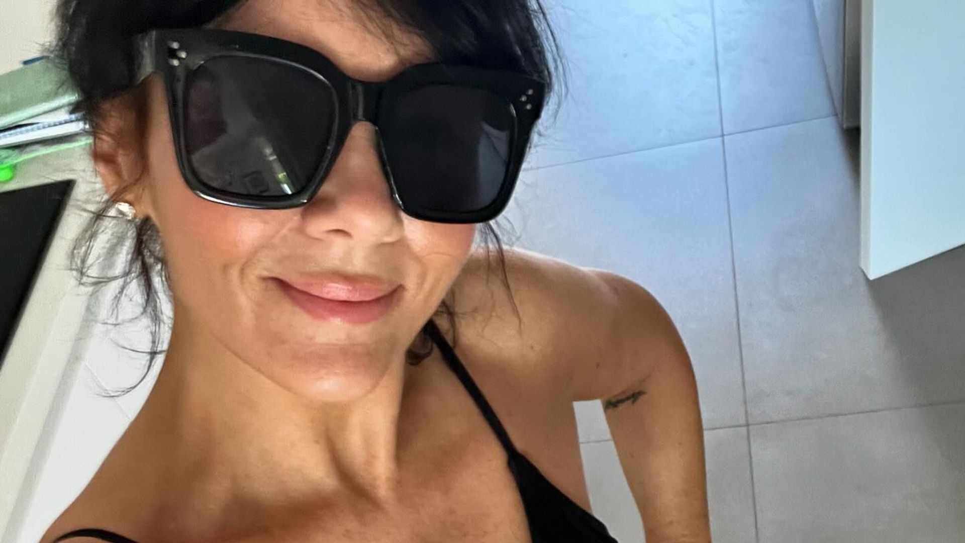 Martine McCutcheon shows off sky-high legs in candid bedroom video following shock split from Jack McManus