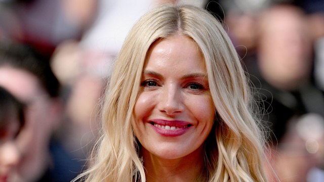 Sienna Miller wearing a blue frill-lined gown at Cannes Film Festival