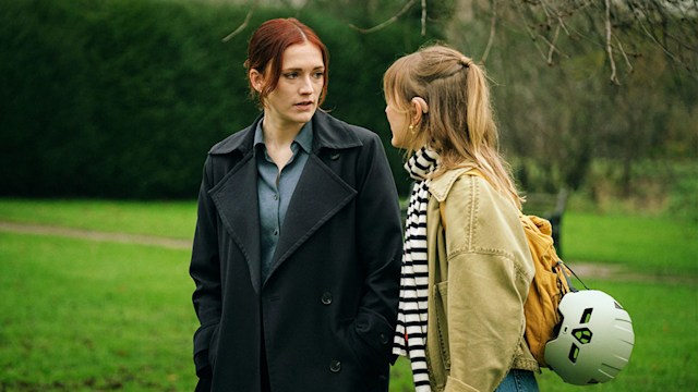 Two women walking in park