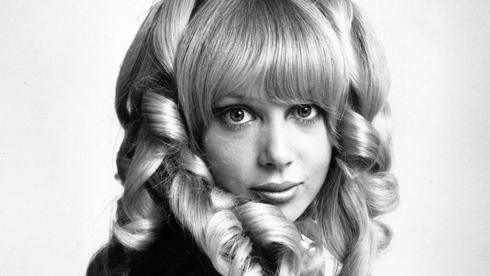 1967:  Fashion model Patti Boyd, wife of Beatle George Harrison, modelling a wig.  (Photo by McKeown/Express/Getty Images)