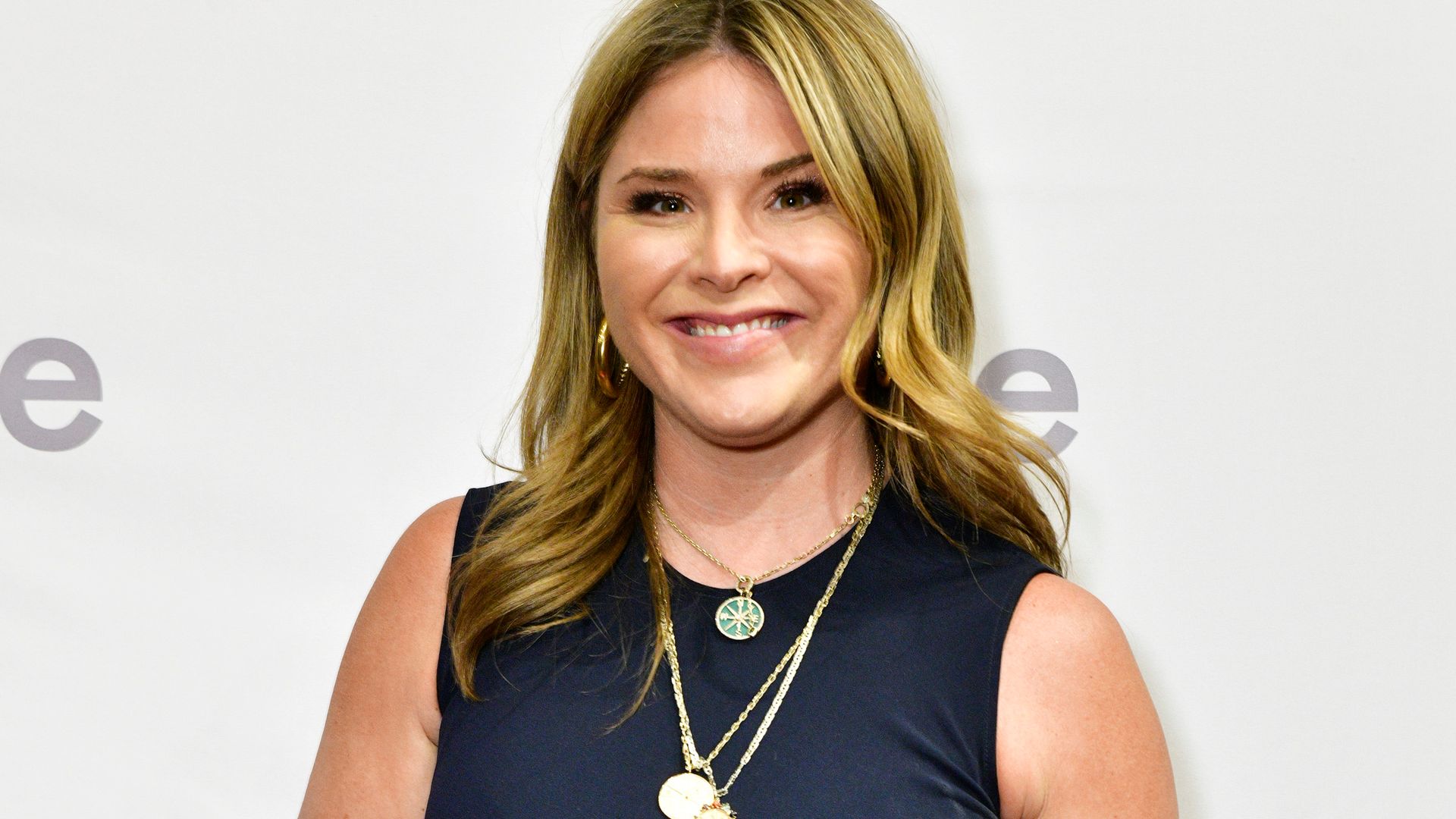 Jenna Bush Hager smiling at the camera on a red carpet