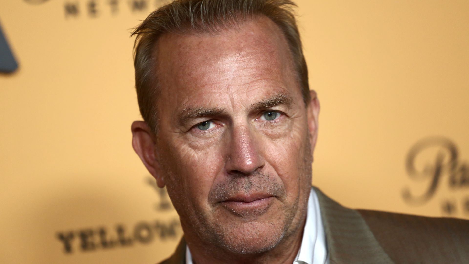 Kevin Costner on the red carpet in a smart outfit