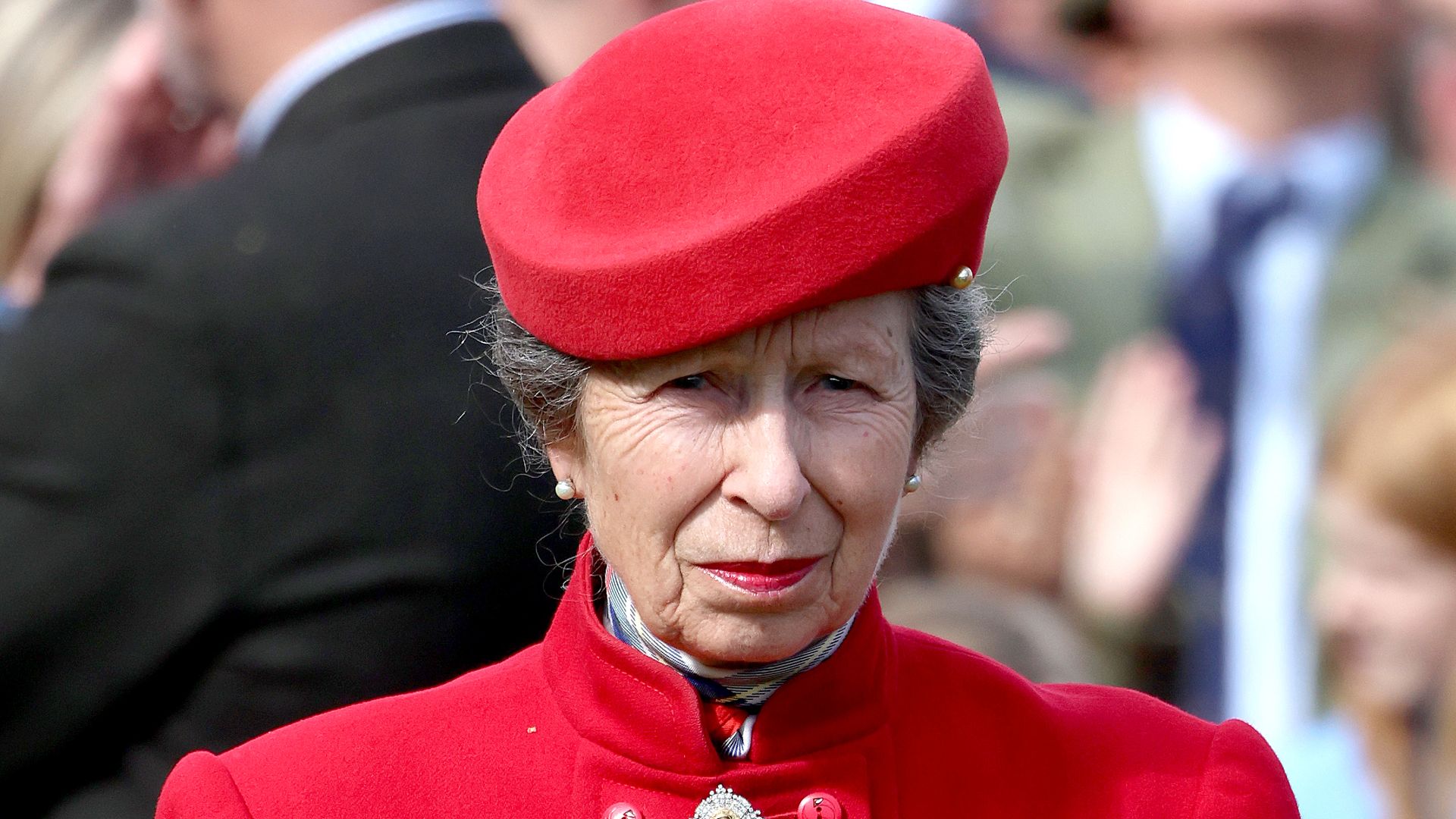 Princess Anne is a lady in red rocking silhouette-skimming coat and cherry midi skirt