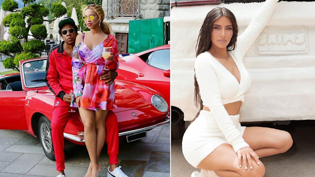 Kim Kardashian and Jay Z and Beyonce posing in front of cars